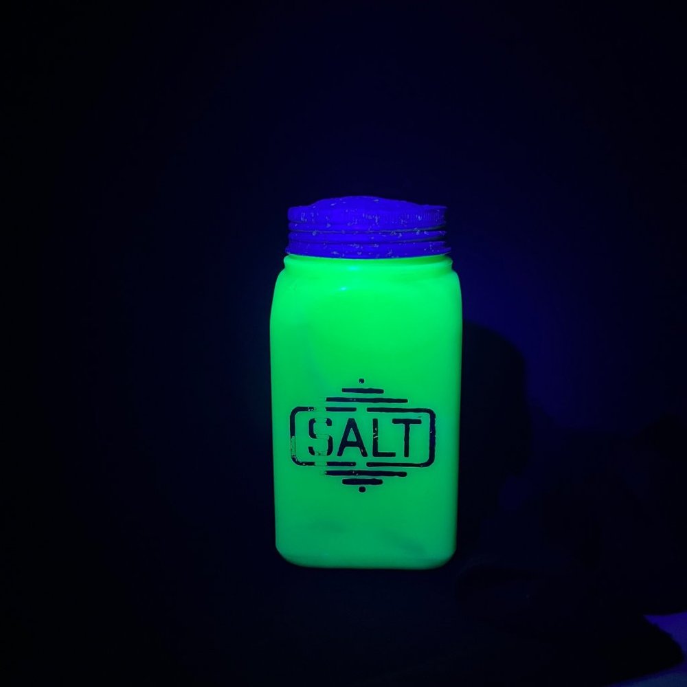 McKee Jadite Uranium Large Letters Glass Salt Shaker - Damaged Lid Front Graphic